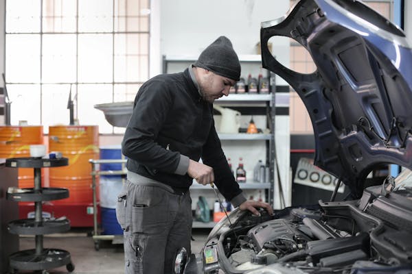 Engine repair service Jessup MD - mechanic performing diesel engine diagnostics